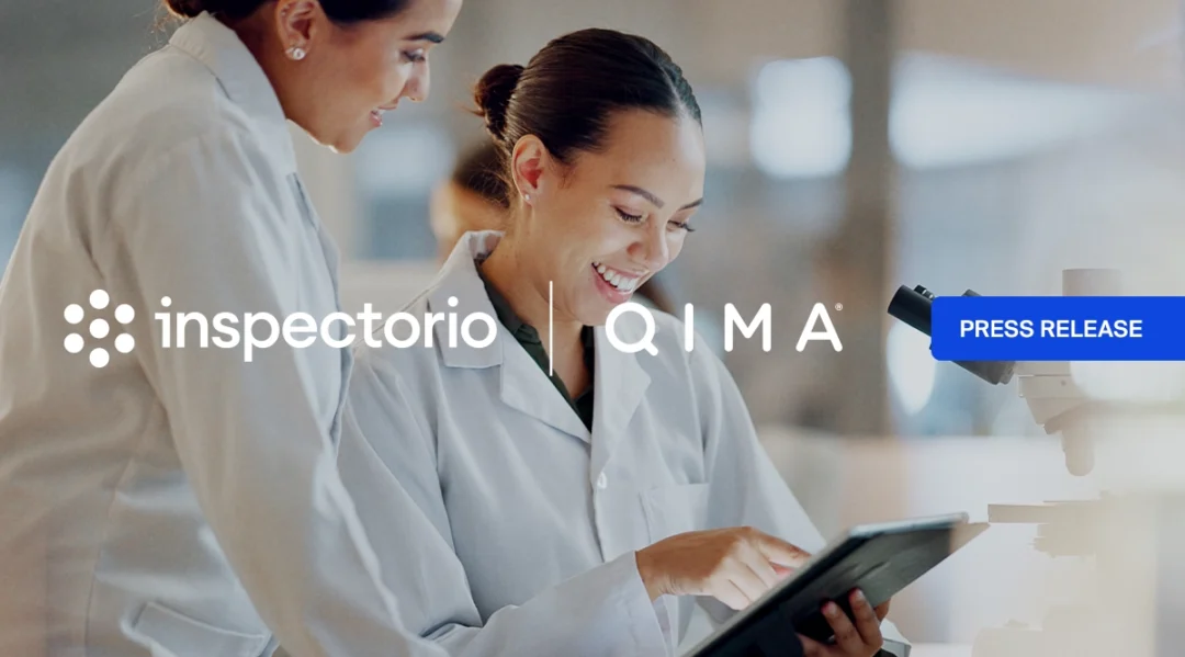 Inspectorio and QIMA press release banner with two lab professionals reviewing a tablet in a laboratory setting.